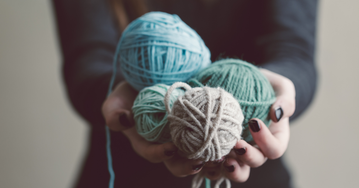 hands holding yarn