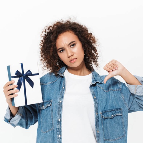 woman with gift giving thumbs down
